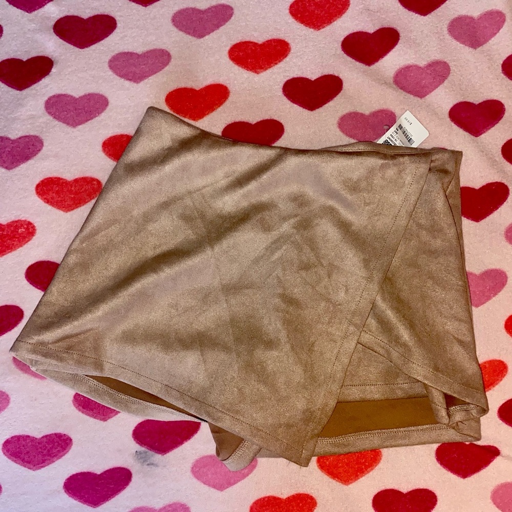Tan short skirt with shorts underneath